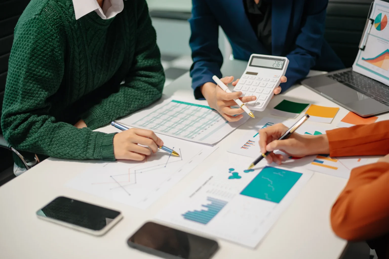 business-professionals-analyzing-data-charts-in-of-25LXMXY.webp